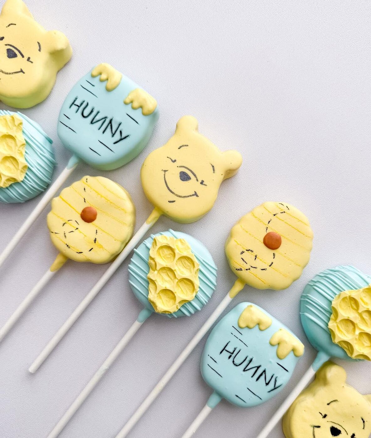 Winnie the Pooh themed decorated cake pops