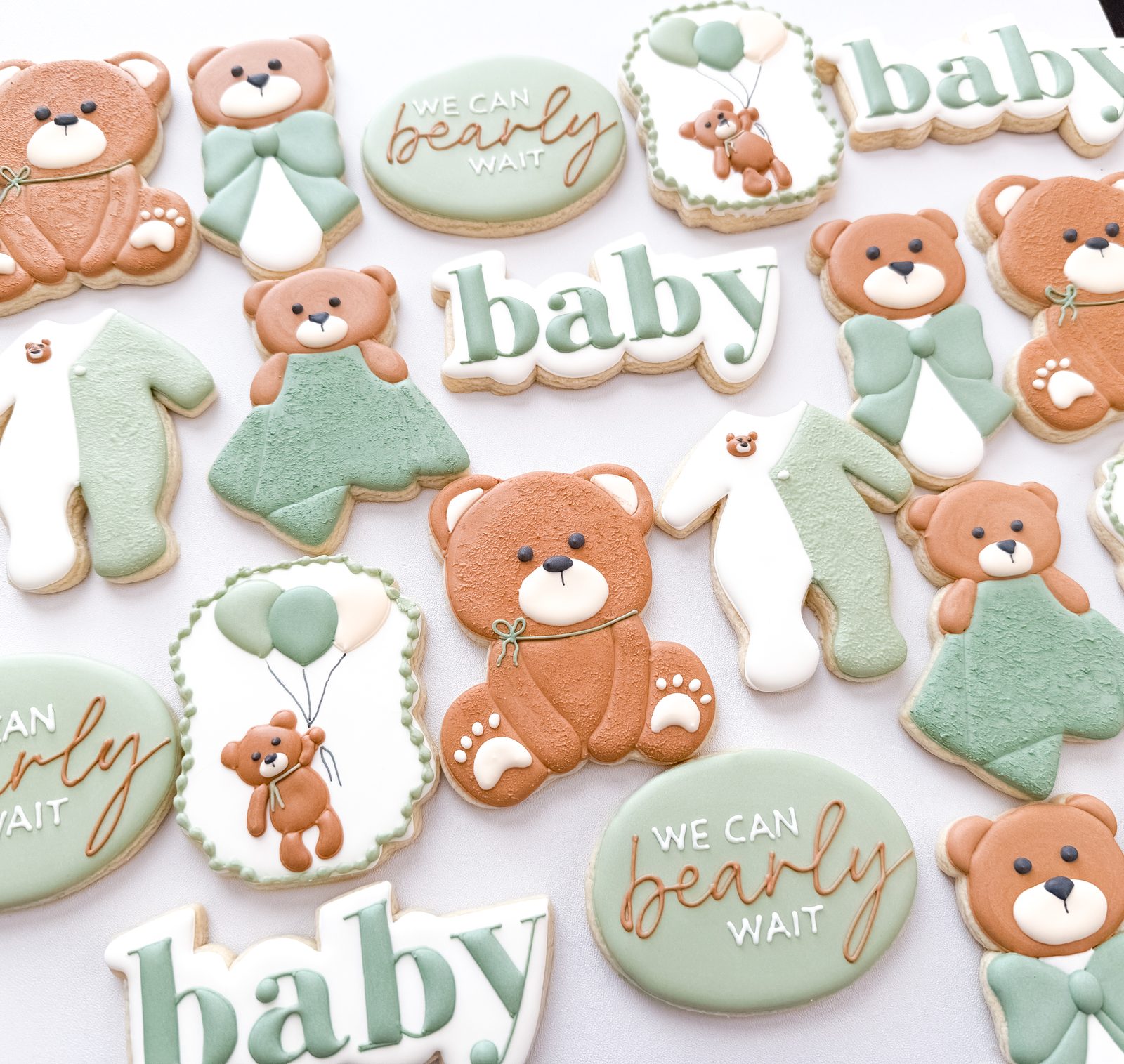 We Can Bearly Wait baby shower cookies with sage teddy bears, sleepers, and balloons