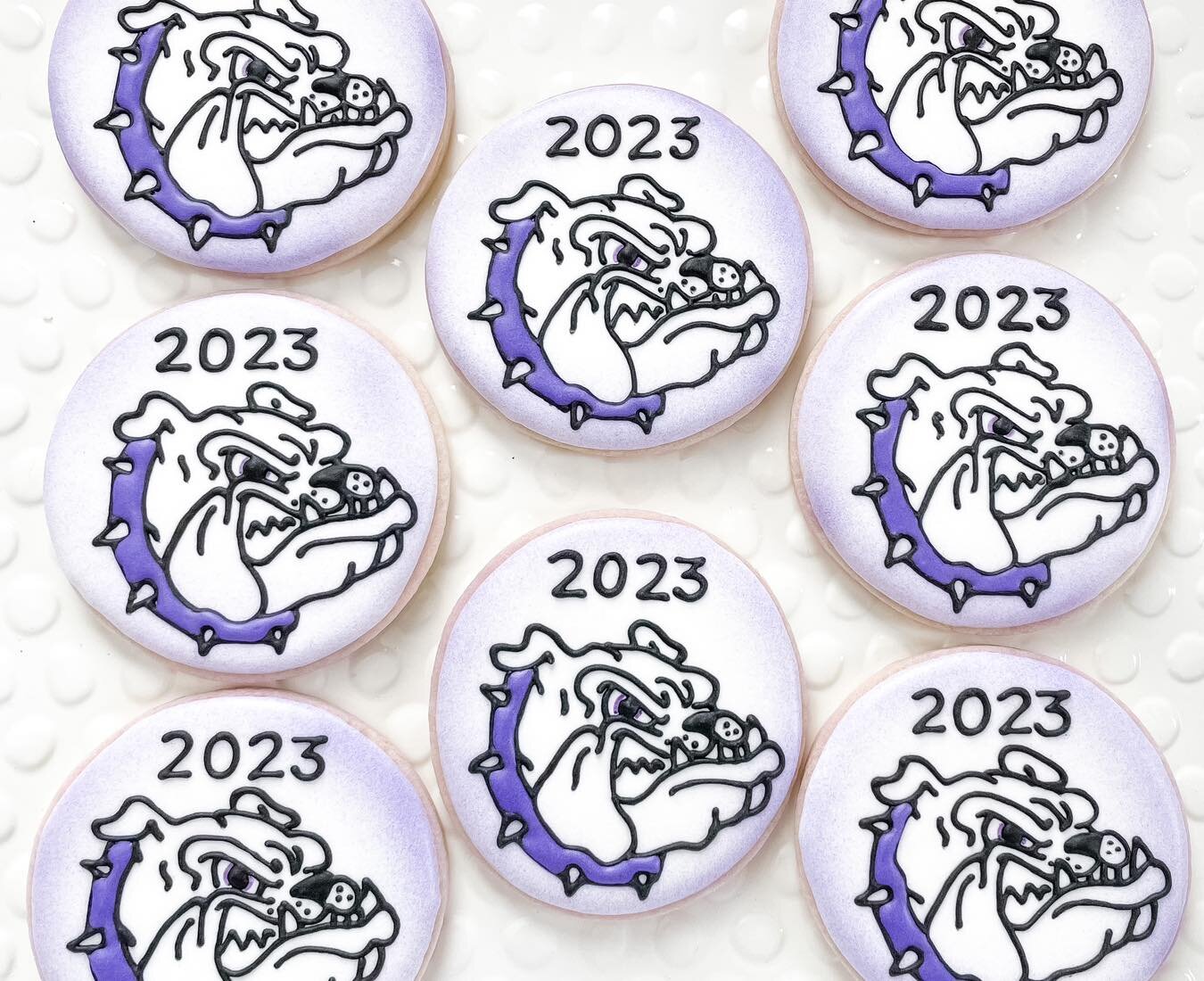 Bulldog mascot graduation cookies with hand-piped 2023 details