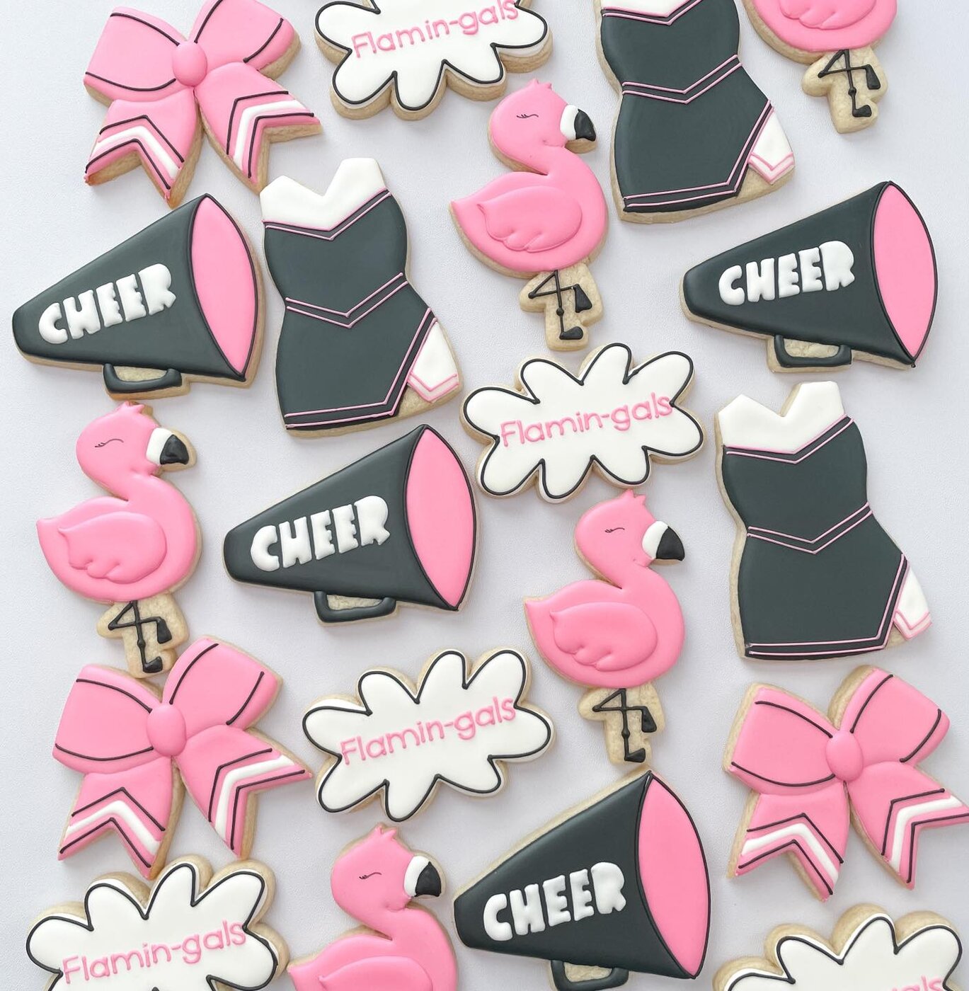 Flamin-gals cheer cookies with flamingos, megaphones, uniforms, and bows