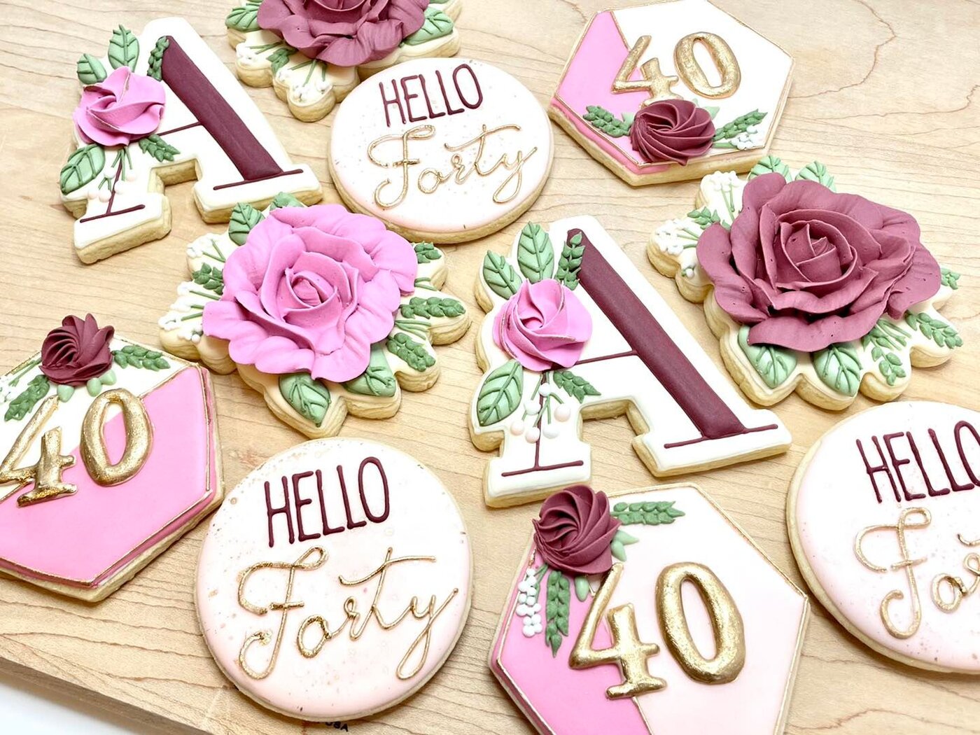 Hello Forty birthday cookies with buttercream roses, gold lettering, and monograms